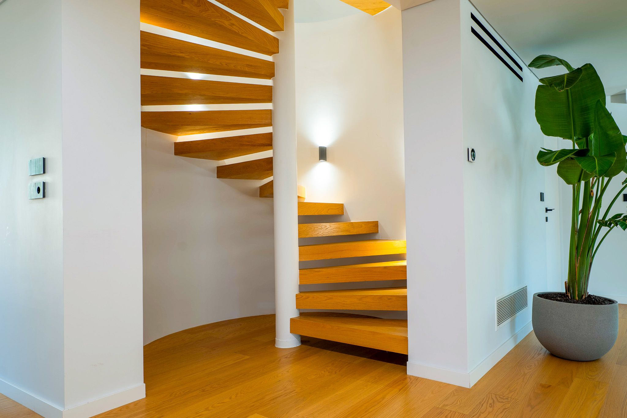 Villa Bond, floating wood spiral staircase with banana plant