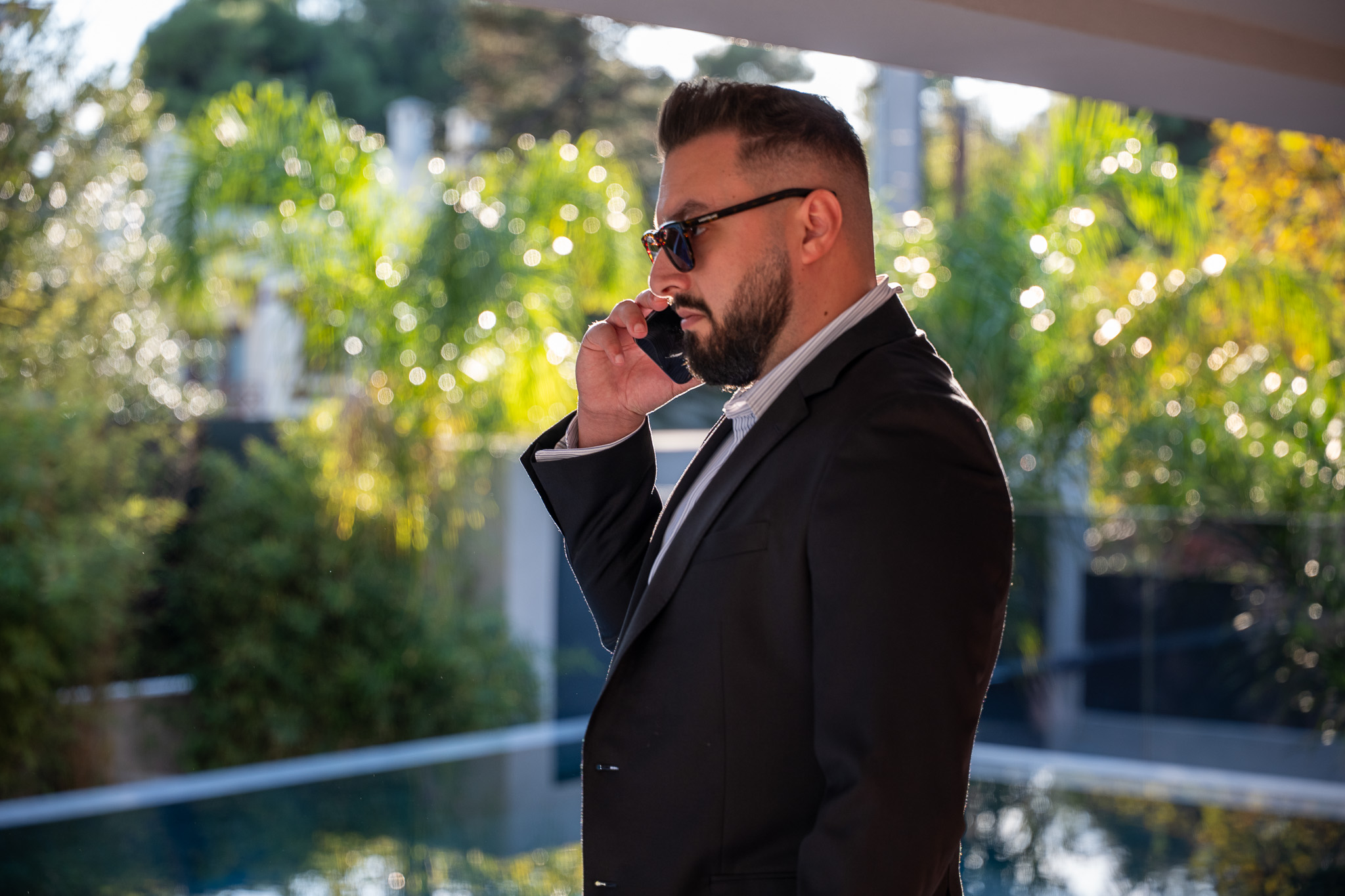 Villa Bond, agency portrait by the pool, golden-hour bokeh