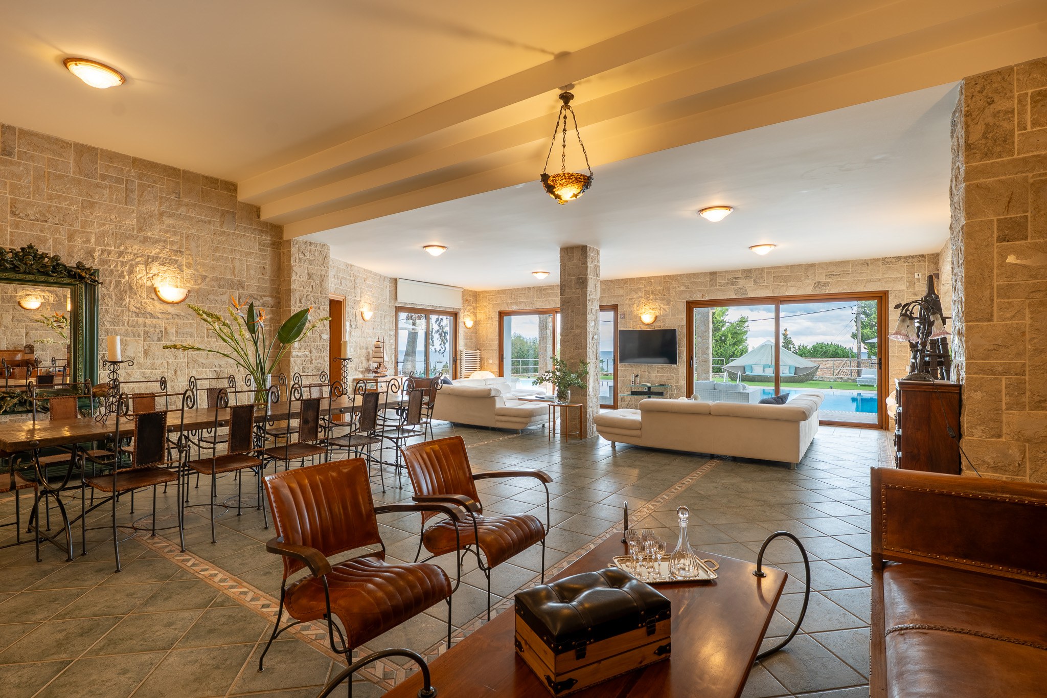 Villa Rafaella, stone-walled lounge with leather chairs