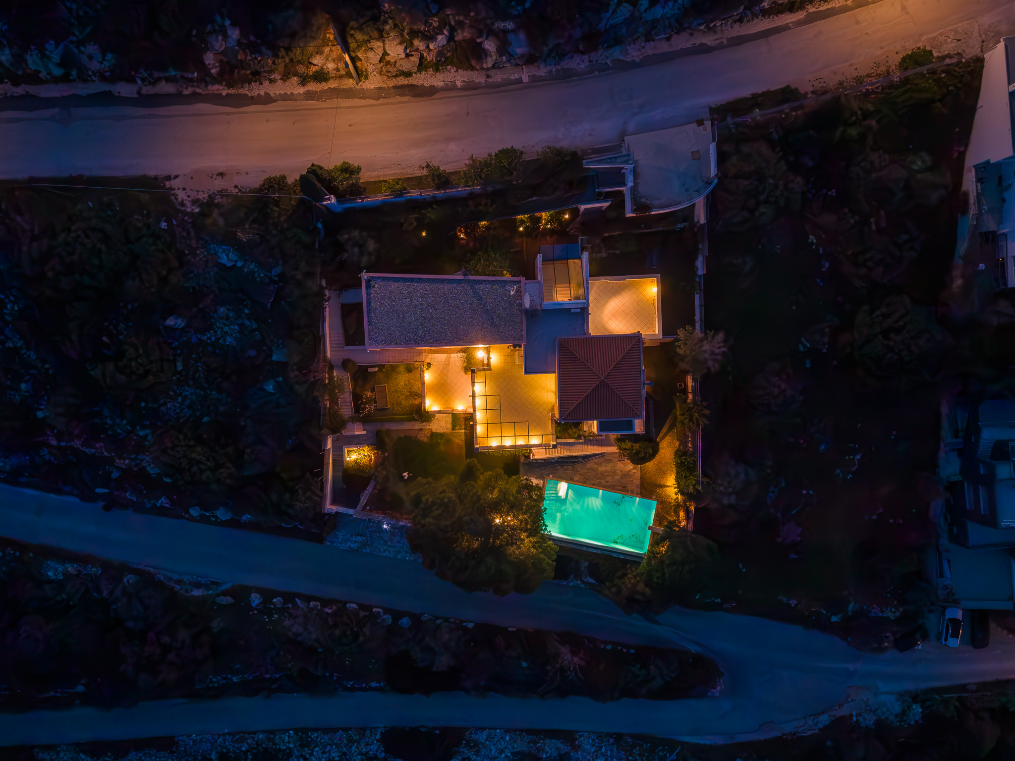 Villa Selene, night top-down aerial of the courtyard and pool