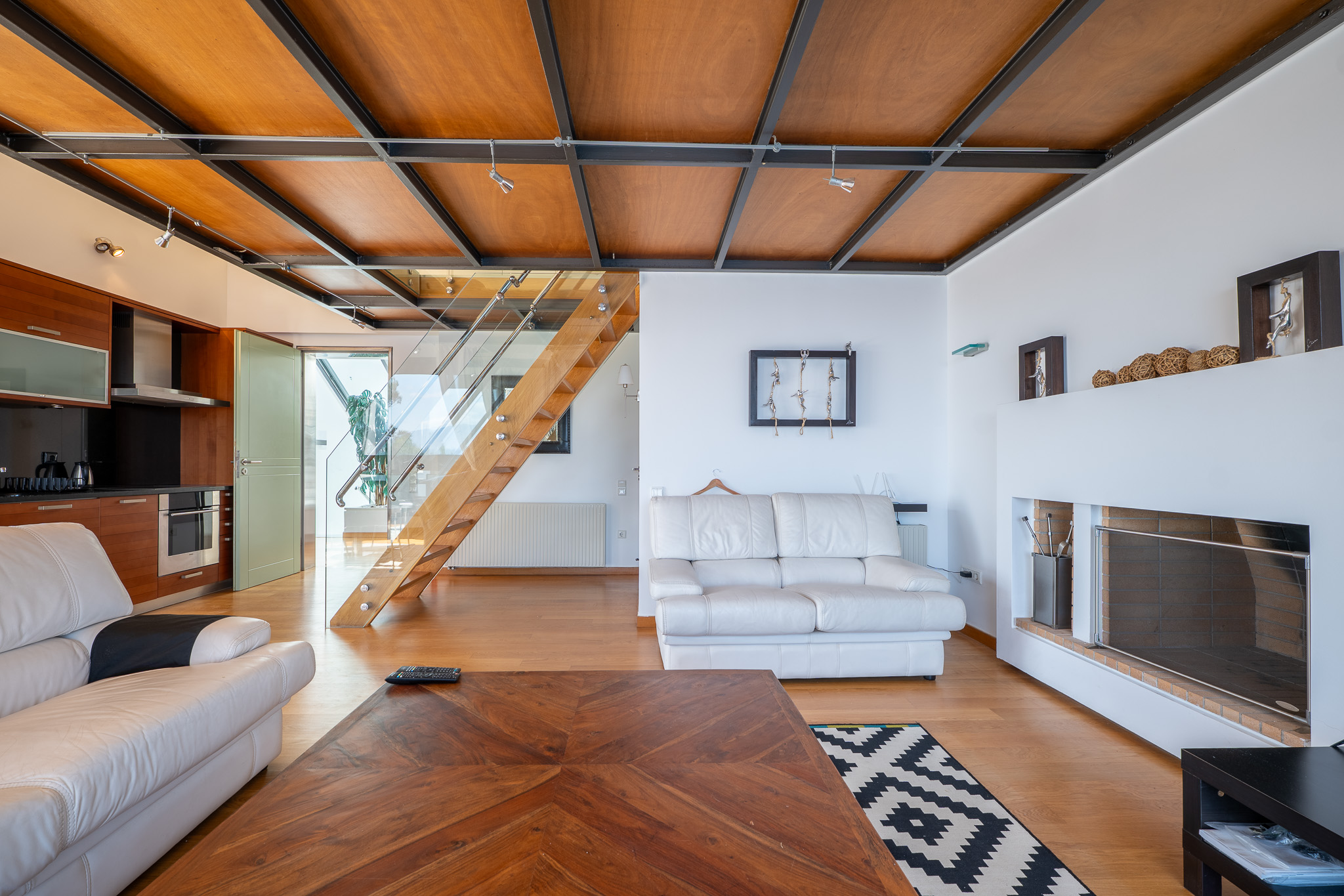 Villa Selene, living room with timber-grid ceiling and fireplace